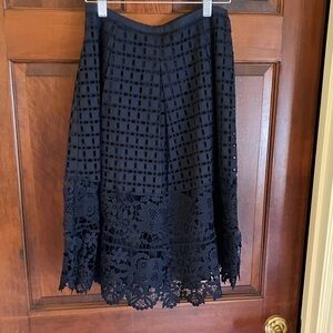 Super cute dark blue Talbots size 2 lacey skirt, fully lined.